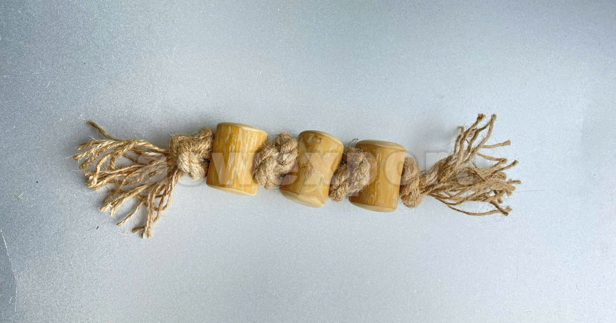 Natural coffee wood dog chew toy with durable rope for chewing and tug play